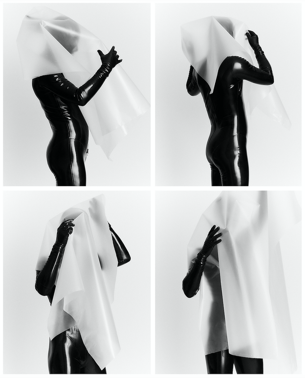Person in black latex bodysuit wraps white sheet around head in four-panel sequence. Minimalist setting, dramatic contrast, mysterious mood.