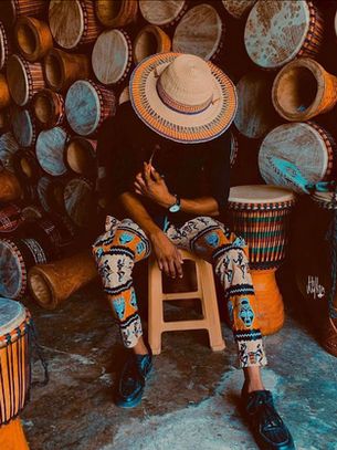 man with handmade drums in Accra