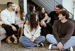 a family of seven adults interact with each other