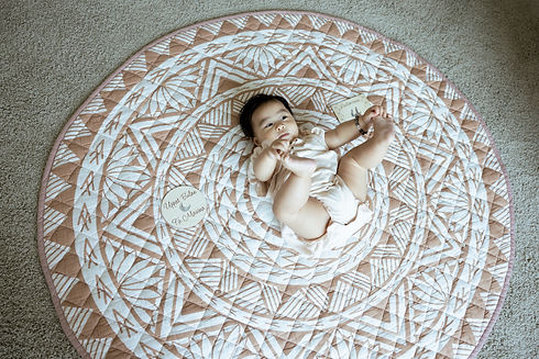 baby girl doing a happy baby