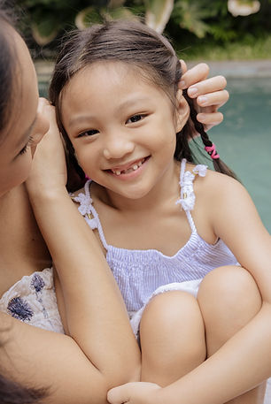 5-year-old girl smiles at the camera
