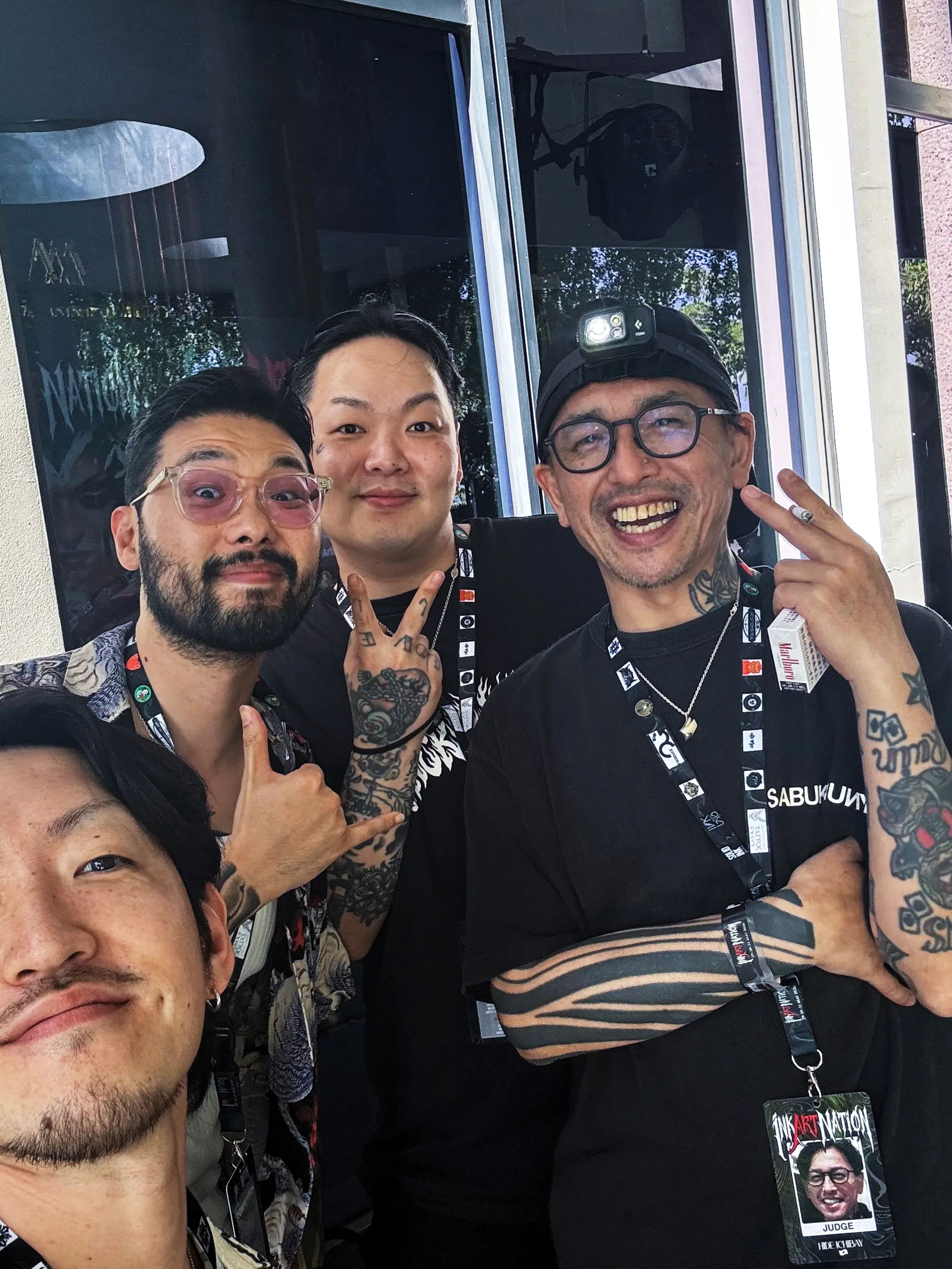 Seoul Ink Tattoo team members posing together outside the venue at Ink Art Nation Vietnam 2026