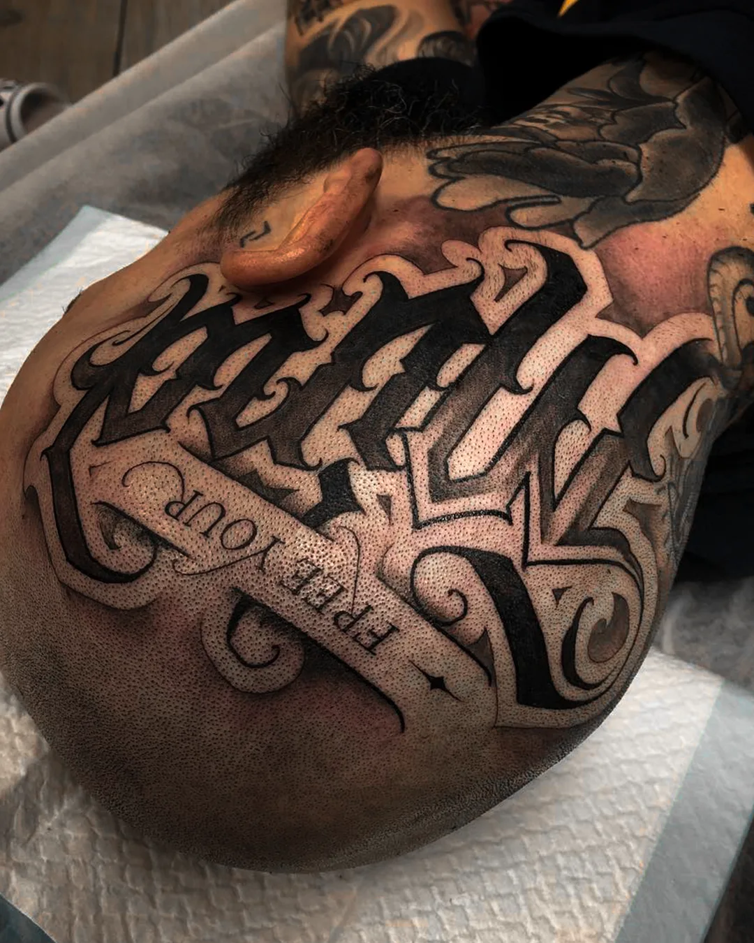 Custom Lettering tattoo on the head done by guest artist Mystik. Seoul Ink Tattoo Gangnam, Seoul South Korea