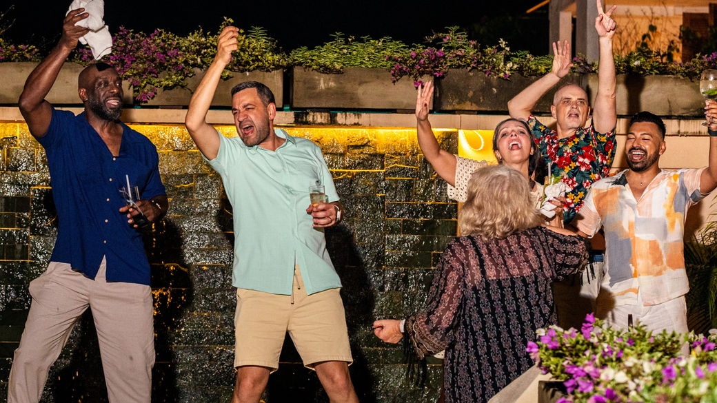 Friends dancing during a private gay celebration in Cartagena’s historic walled city—part of an OUT in Colombia event experience