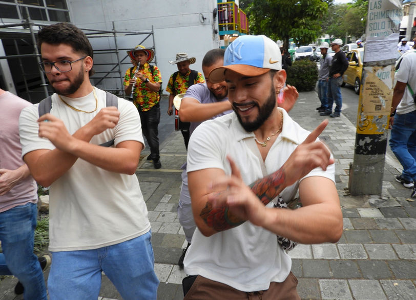 Guests dancing through the lively streets of El Poblado during OUT in Colombia’s Drink & Dance Experience—part of a vibrant Medellín gay tour.