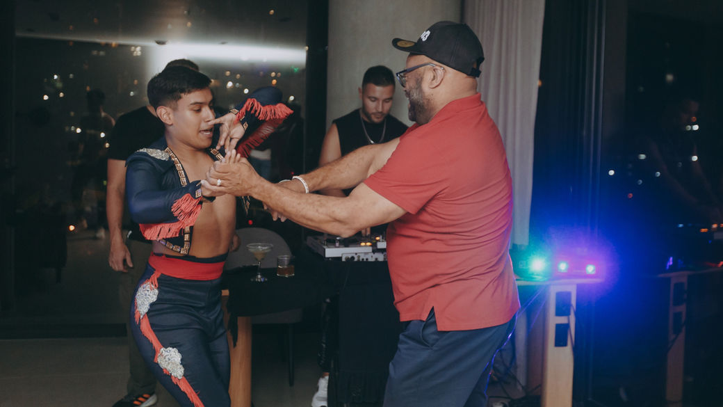 Playful dance-off during a private gay bachelor party in Medellín’s vibrant nightlife scene