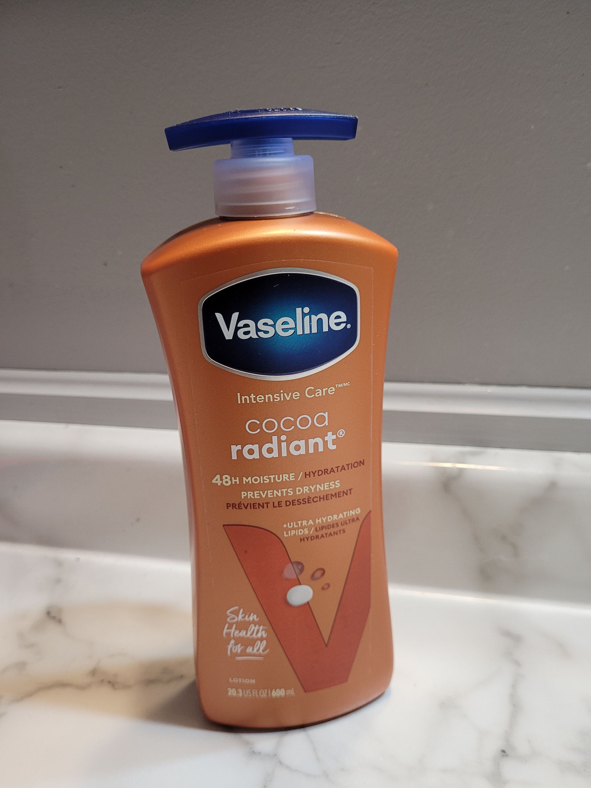 Brown vaseline Lotion photo on  a marble surface