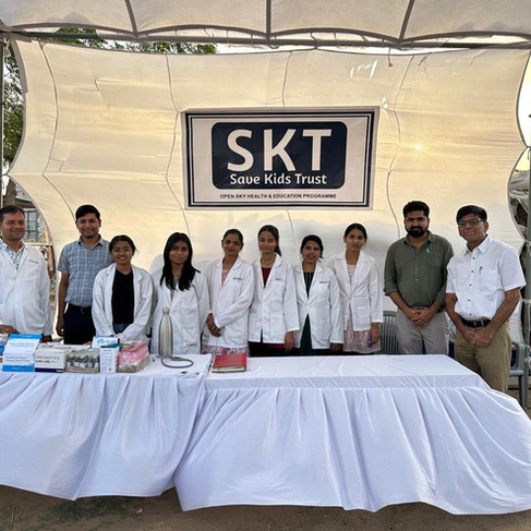 The Save Kids Staff on site the afternoon of the event. A warm wind is blowing.