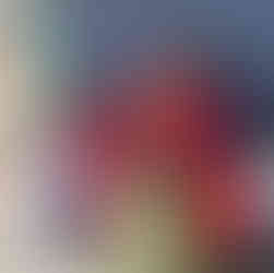 A mom and her child sitting by the exam table in the clinic.