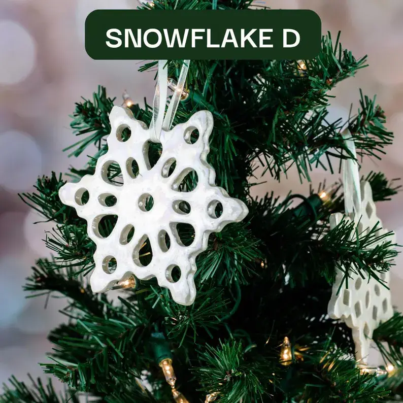 Thumbnail: Handmade Ceramic Iridescent Soft-White Snowflake Christmas Ornament Hanging on Christmas Tree