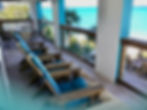 deck and adirondack chairs