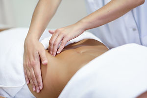 woman-receiving-belly-massage-spa-salon.jpg