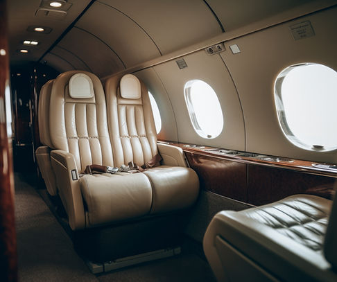 clean brown leather seat inside of a jet