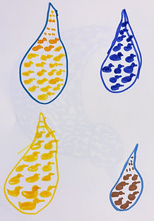 multi colored raindrops on white paper