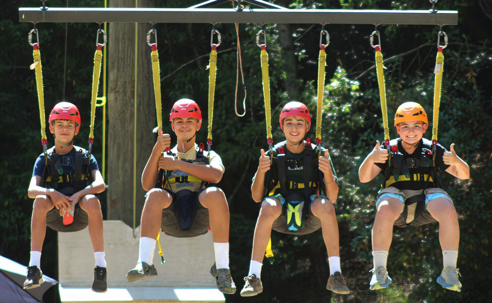 4 boys on giant swing
