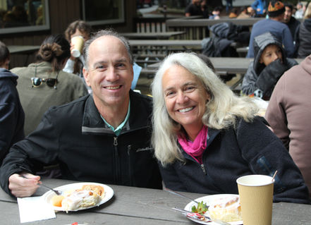 smiling man and woman at table