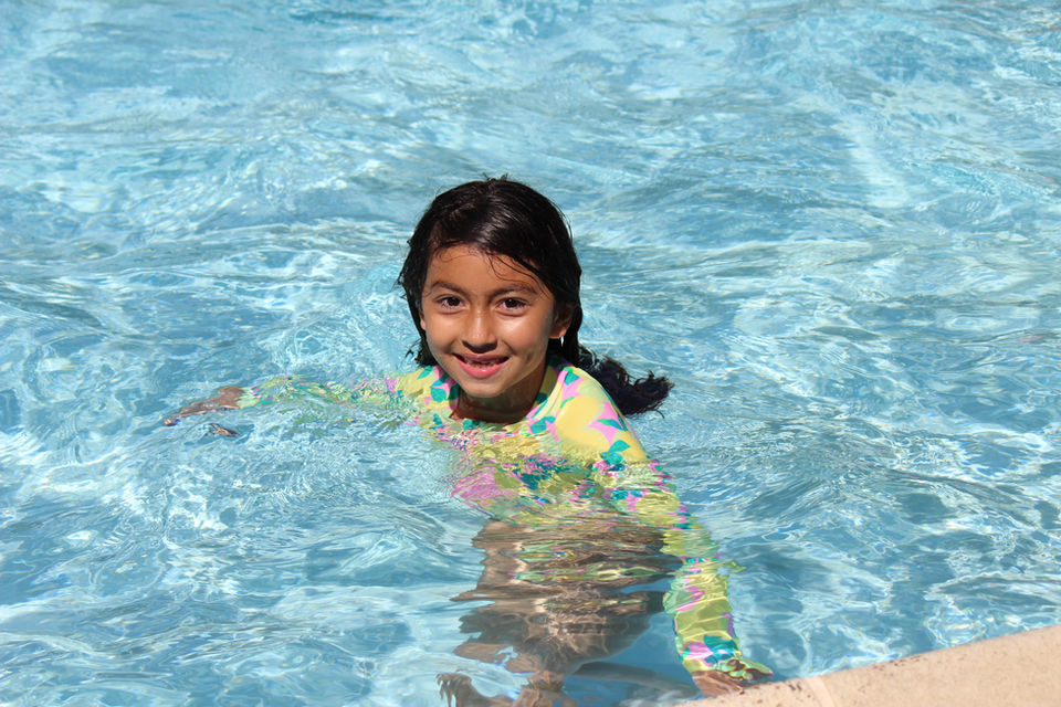 girl smiling in pool
