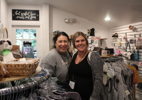 2 smiing ladies in gift shop