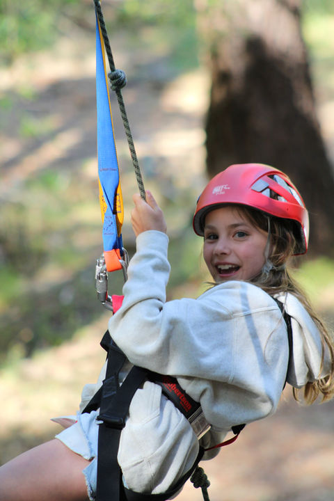 girl smiling on zipline