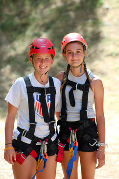 2 girls in zipline smiling