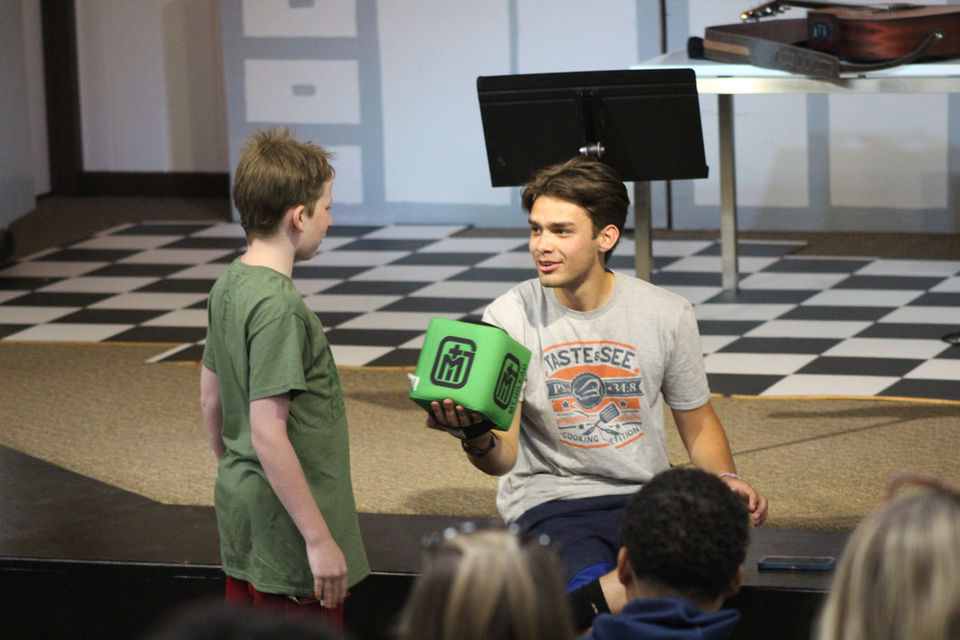 Counselor with cube looking at counselor