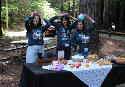 3 ladies with teapot/cups on their heads