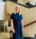 Nat Sharp standing on a staircase