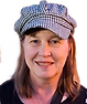 Smiling author in a checked cap