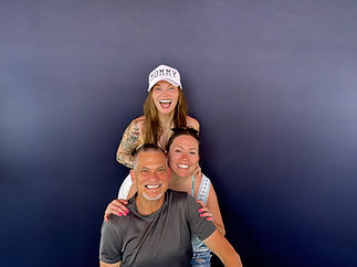Smiling group posing at a photo booth rental in Greenville TX