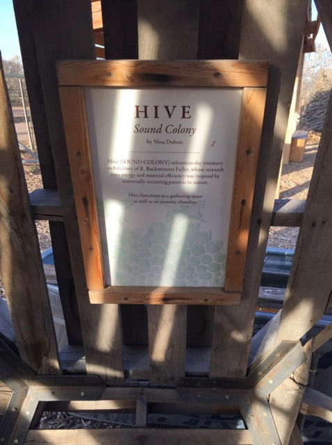This sign explained the dome’s inspiration and intention. The artist is Nina Dubois. It reads, “Hive (SOUND COLONY) references the visionary architecture of R. Buckminster Fuller, whose research into energy and material efficiency was inspired by universally occurring patterns in nature. Hive functions as a gathering space as well as an acoustic chamber.”