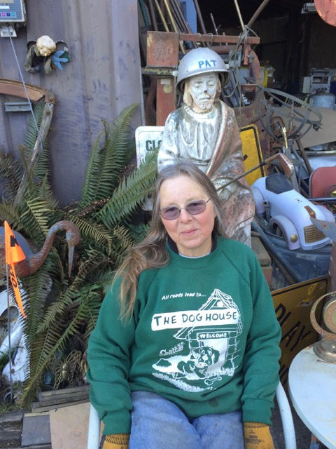 This is Jill, the owner’s wife, in front of Pat, the Irish saint who now wields a golf club.