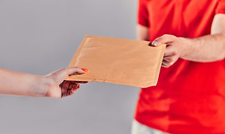 close-up-of-mailman-delivering-mail-to-person-over-gray-background.jpg