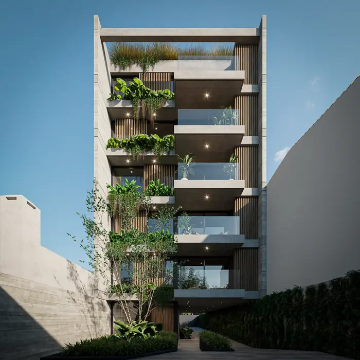 Fachada de edificio de planta baja y 5 pisos entre medianeras. es de hormigon visto, tiene vegetacion en balcones.