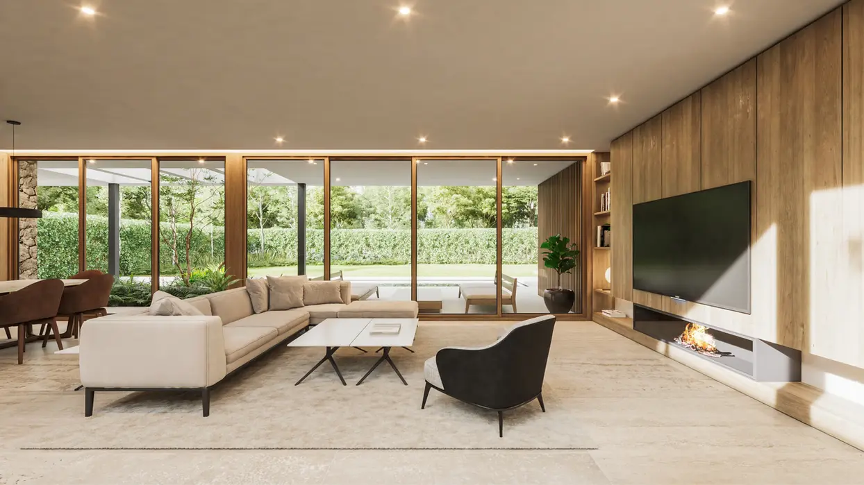 living comedor con sillones claros, hay un ordenado de tv de madera, un biohogar.