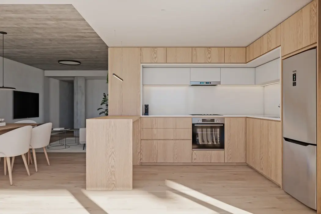 cocina integrada a estar comedor, los muebles y la barra son de madera.