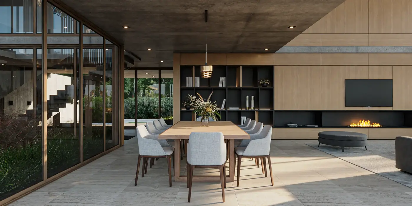 Es una interior de una casa moderna. Con muros revestidos en madera. El piso es de Travertino. La losa es de hormigon visto. Es un comedor con un colgante sobre la mesa. tiene sillas tapizadas.