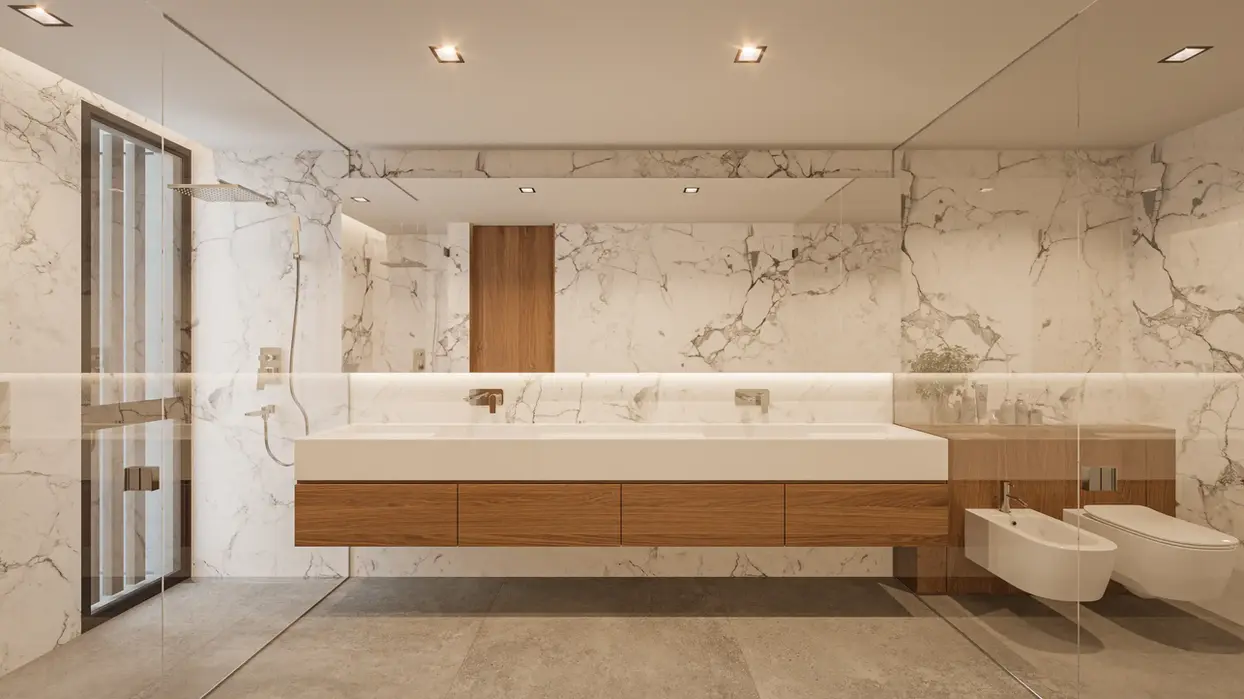Baño revestido en marmol. vanitori flotante de marmol con mueble de madera.