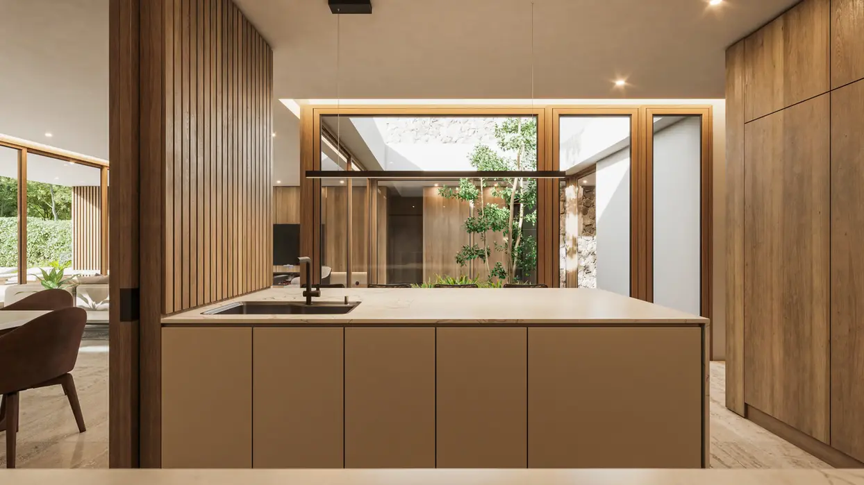 cocina semi integrada revestida en madera con isla de calacata. el piso es de travertino.