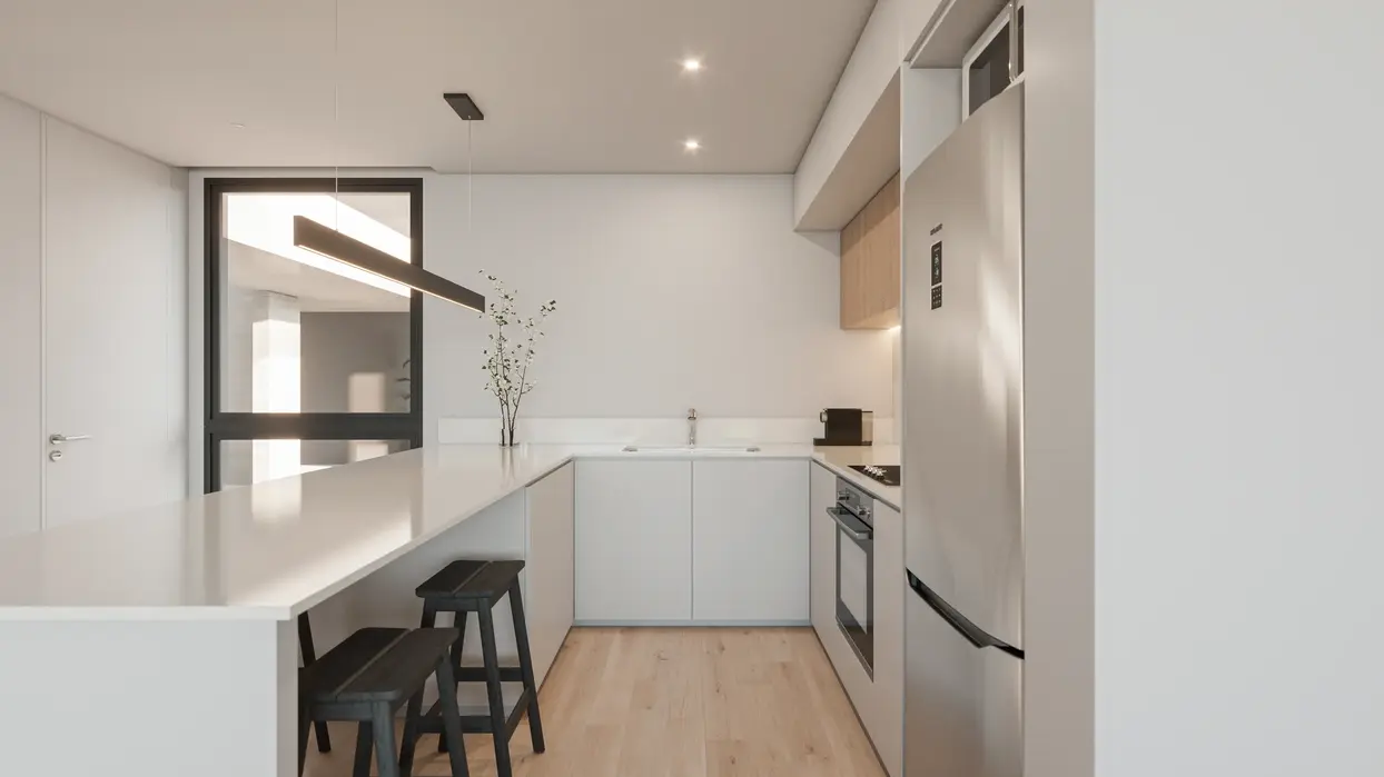 cocina blanca integrada a estar coomedor, pisos de madera.
