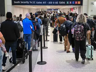 Travelers wait in line at a TSA security checkpoint at George Bush Intercontinental Airport in Houston, Texas, on March 20, 2026.