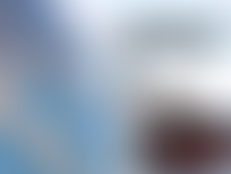 Globe in front and cargo ship in the back