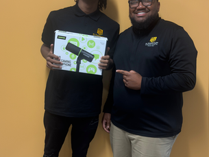Mwanje Thompson takes a picture with Edwin’Lee Lawrence and his new MV6 USB Gaming Microphone
