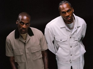 Clipse members Pusha T and No Malice pose in coordinated outfits ahead of their 2025 album release, Let God Sort 'Em Out.