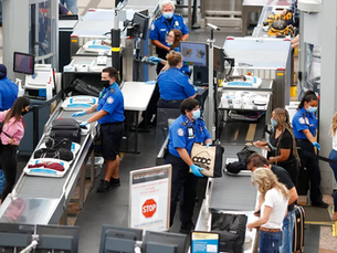People getting checked by TSA