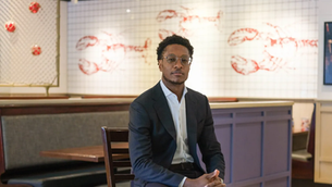 Red Lobster CEO Damola Adamolekun speaking during a media interview
