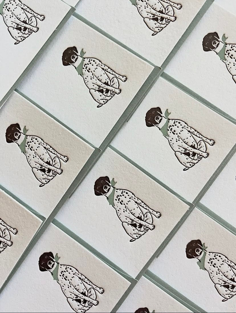 Cards with a printed Dalmatian dog that form a pattern.