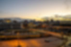Urban cityscape at dusk with streetlights glowing. Same Day Courier Baltimore MD.