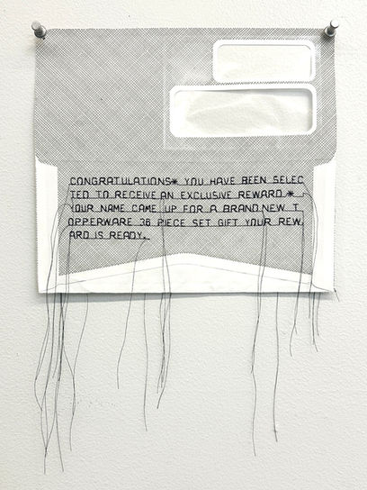 A deconstructed junk mail envelope with block text promising an exclusive reward and 36-piece topperware gift set with hairlike strands hanging off the text.