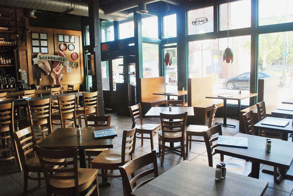 The Corner Tavern dining room and bar with large windows. 