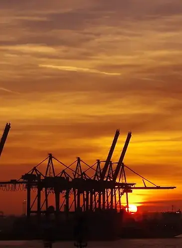 cargo port at dusk representing international exports.webp